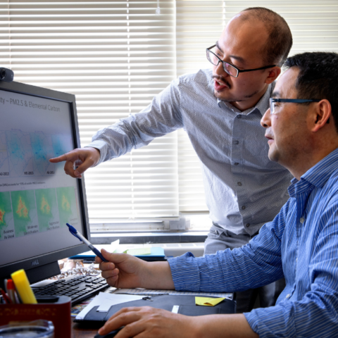 Professor Oliver Gao studies air quality related to automobile emissions with researcher Shuai Pan.