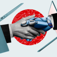 Handshake between a human hand and a robot hand, each extending from laptop computers